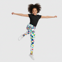 Load image into Gallery viewer, Person wearing colorful polka dot leggings and a black shirt on a white background

