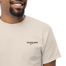 Load image into Gallery viewer, Close up of a Man wearing a SUCCESS WIRE Natural color t-shirt with SUCCESS WIRE Logo on a white background
