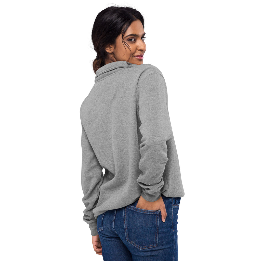Woman wearing a SUCCESS WIRE gray quarter zip pullover and blue jeans on a white background