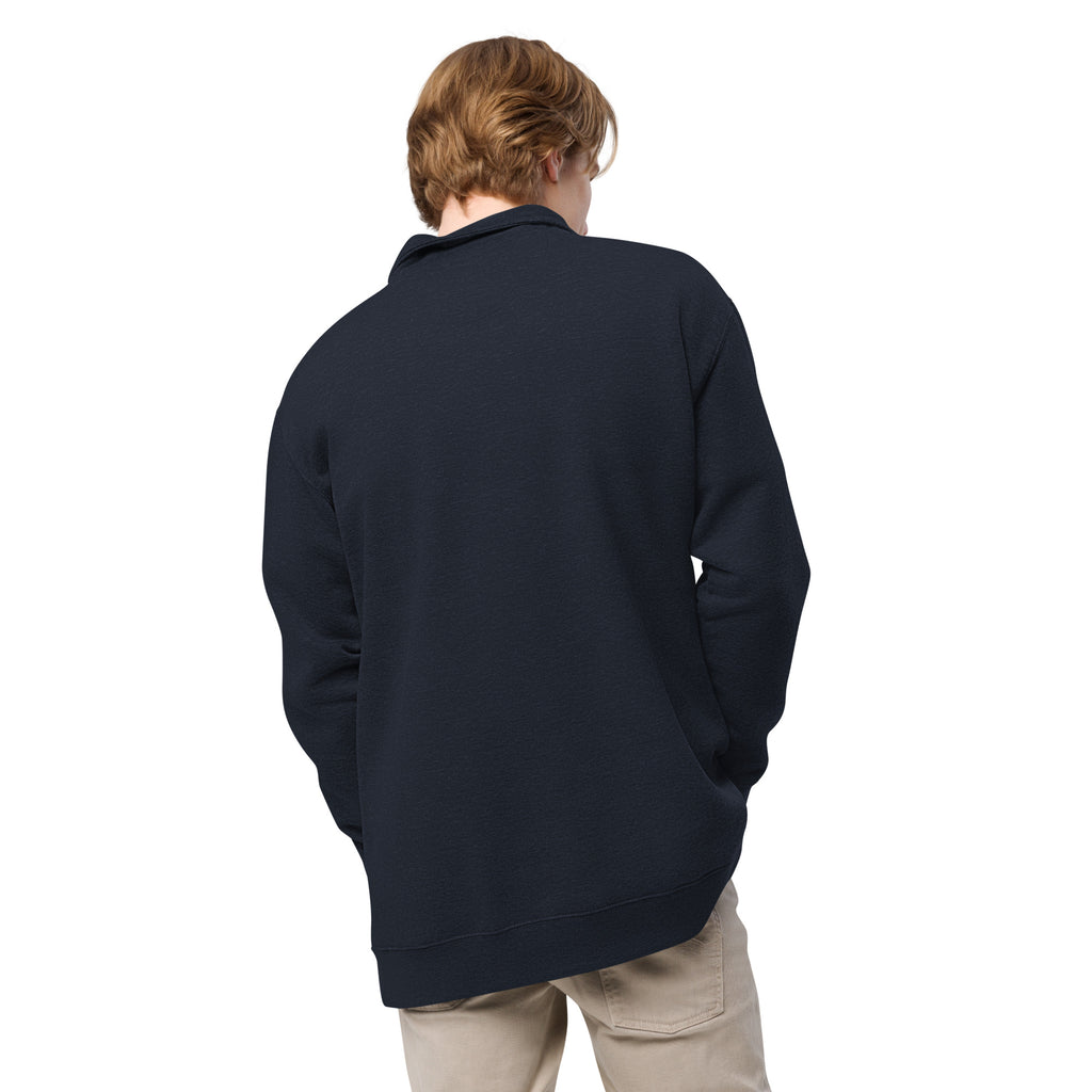 Person wearing a navy blue quarter zip pullover on a white background