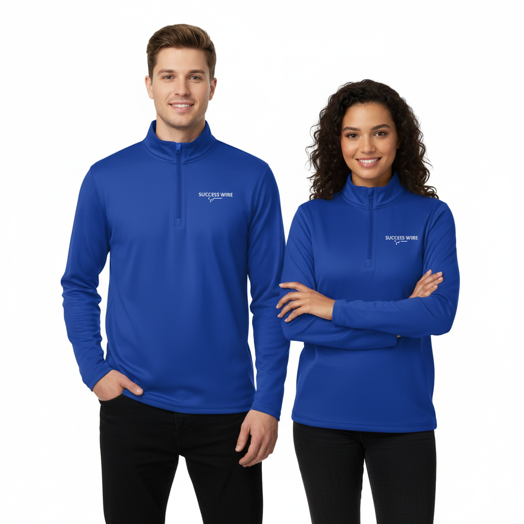 Two people wearing blue quarter zip pullovers with a SUCCESS WIRE logo on a white background
