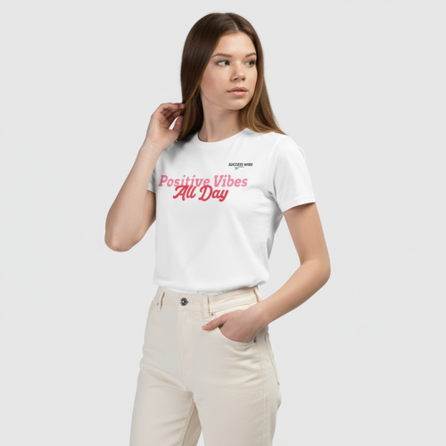 Girl wearing a white t-shirt with 'Positive Vibes All Day' text on a plain background